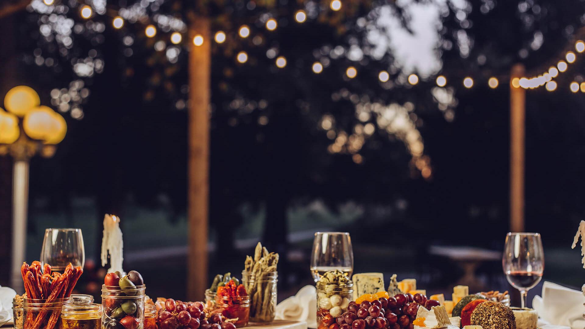 Outside event set up under patio lights and ready for guests.