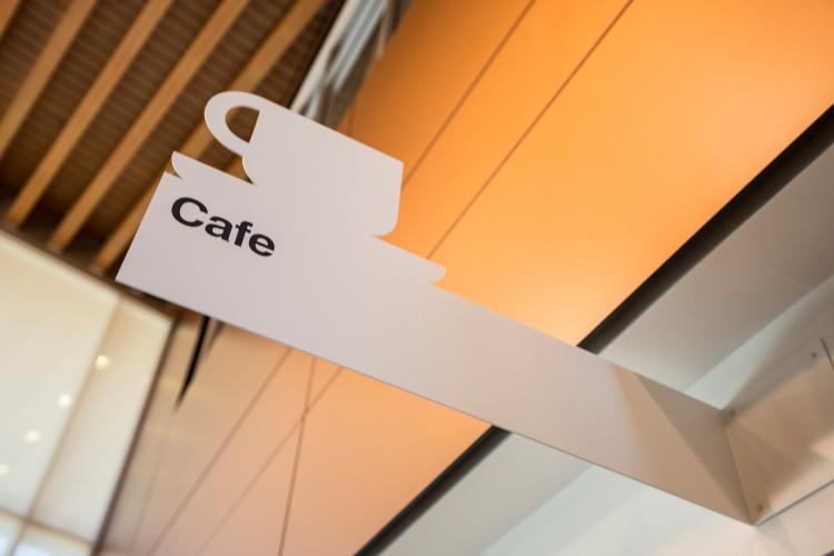 Photo of a Cafe tag coming from the wall