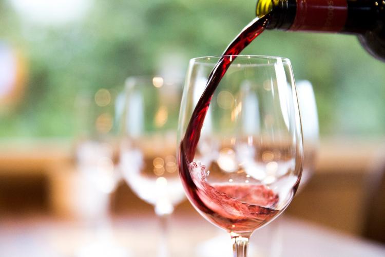 Red wine being poured into a wine glass