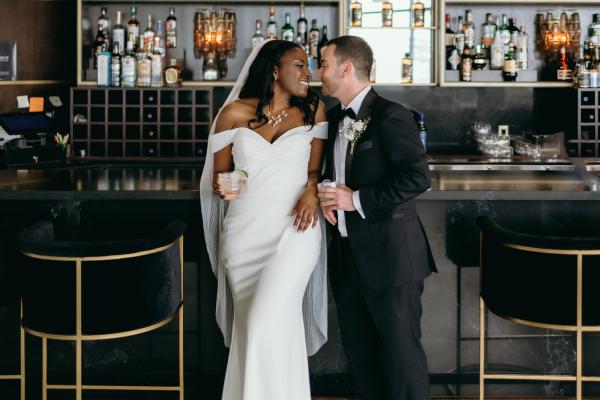 Wedding couple posing at the bar